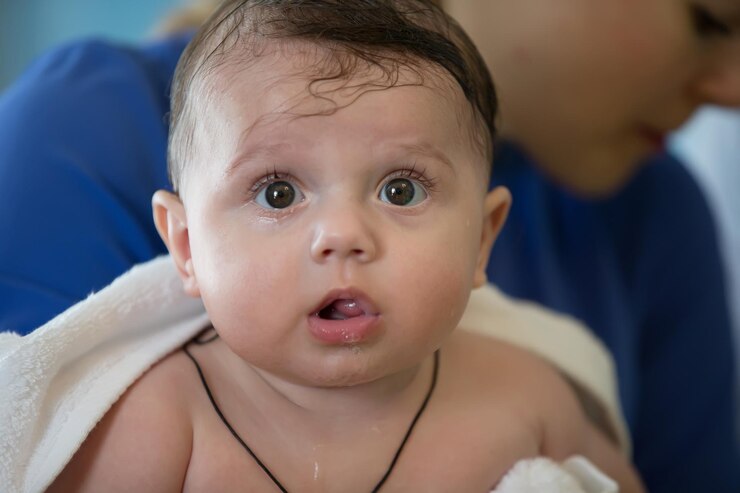 Closeup of a baby's face with big eyes