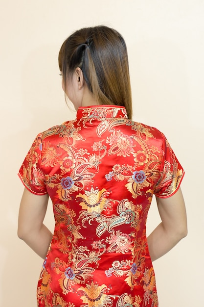 Closeup of back asian woman greeting in traditional Chinese or cheongsam 