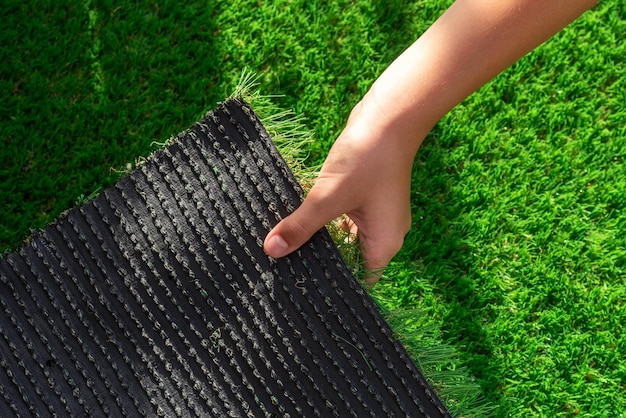 Closeup of the back of a roll of artificial turf Synthetic artificial grass material easy to install