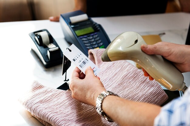 closeup of barcode scanner is scanning a tag