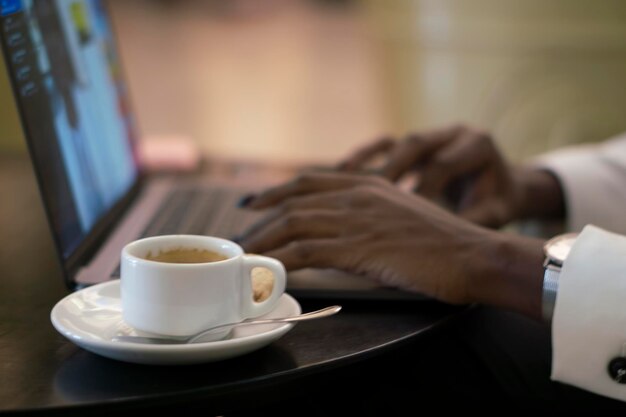 closeup of a beautiful black woman doing office work in a cafe