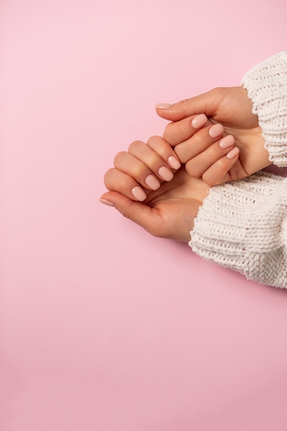 Premium Photo | Closeup of beautiful hands, nails, delicate manicure on  pink background. care, beauty, spa, salon concept, top view, copy space