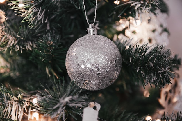 Closeup of beautiful silver ornaments on a festive Christmas tree