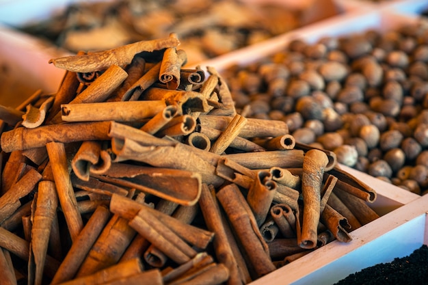 Closeup of a beautiful slide of cinnamon pods on a market showcase.