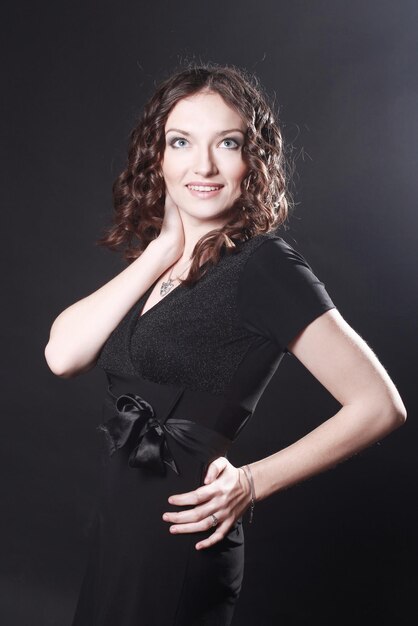 Closeup of beautiful young woman in evening black dress