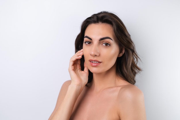 Closeup beauty portrait of a topless woman with perfect skin and natural makeup