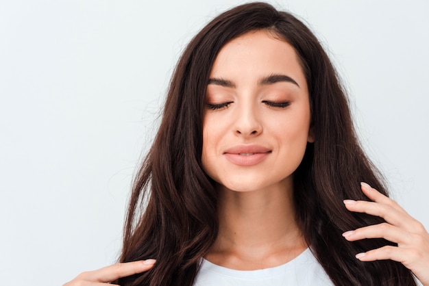 Closeup beauty portrait of young woman with natural makeup and hairstyle. spa and care.