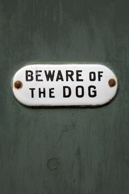 Photo closeup of beware of the dog sign