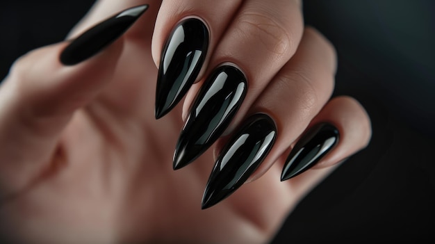 Closeup of black glossy stiletto nails