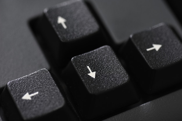 Closeup of a black keyboard arrow button