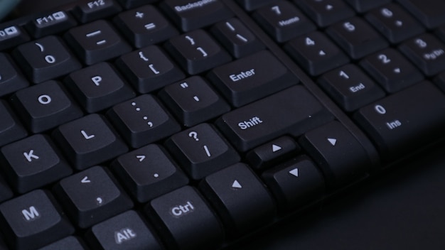 Closeup black keyboard on dark background