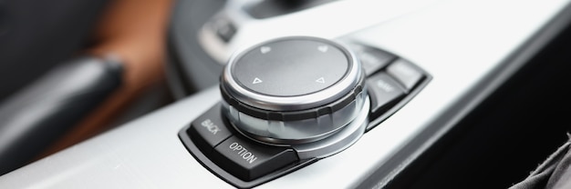 Closeup of black knob control in car