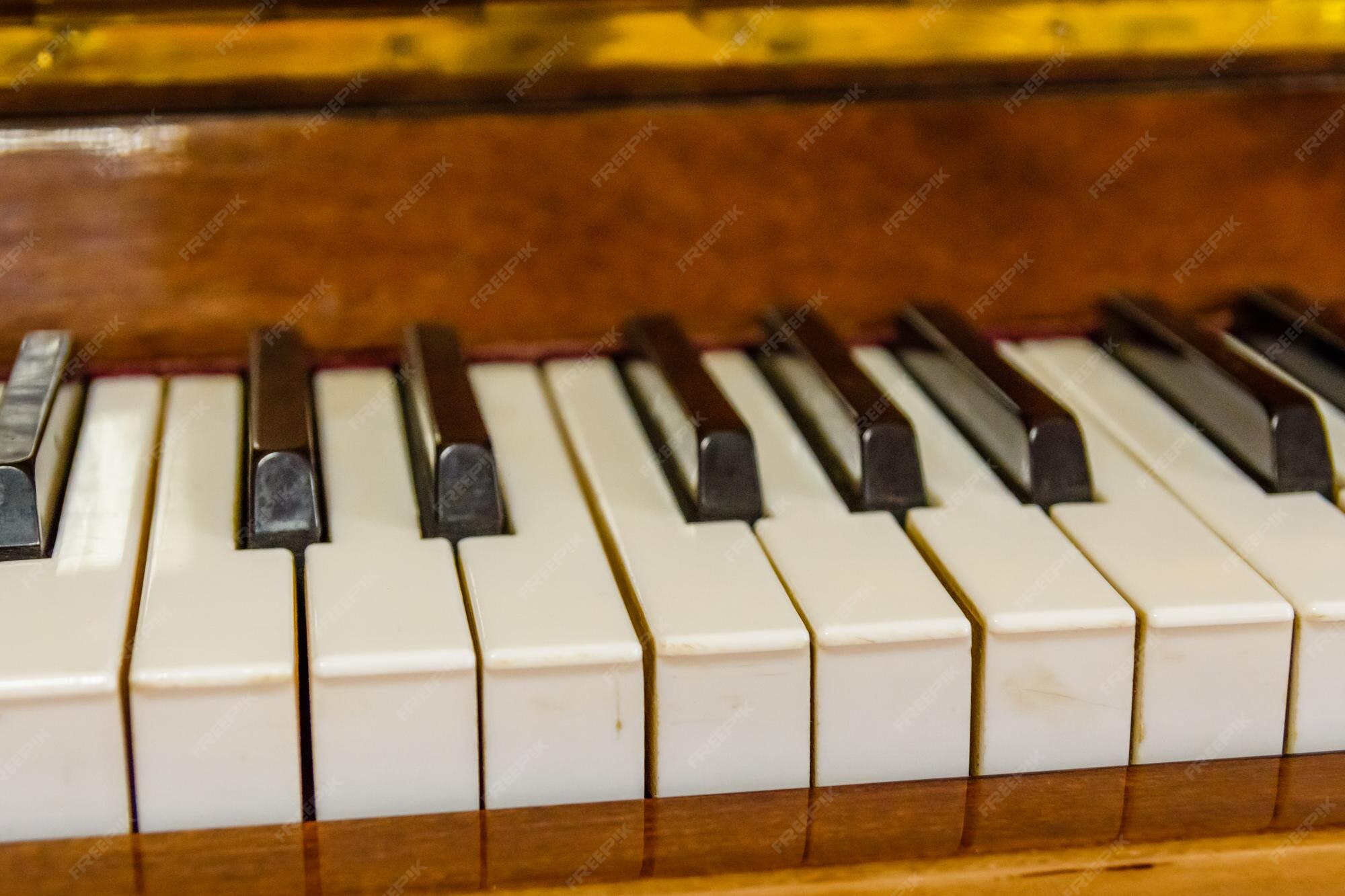 Premium Photo | Closeup of the black and white piano keys
