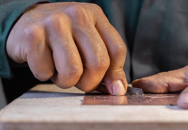 closeup of blacksmith artisan craftman shaping metal