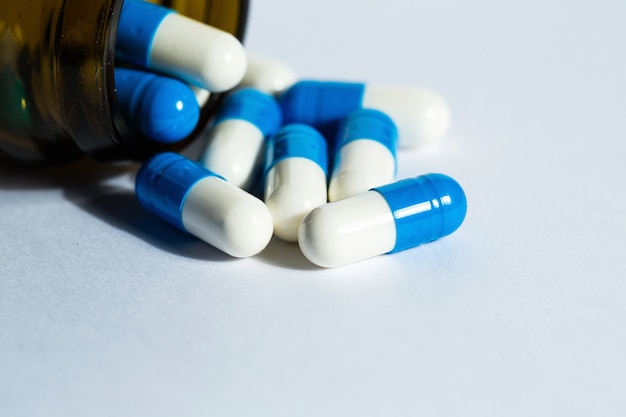 Closeup of bottle with pills on table