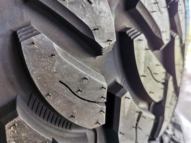 Closeup of a brand new studded tire tread. Selective focus.