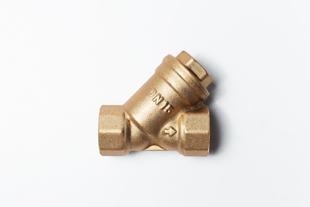 Closeup of brass filter for water before meter on white background