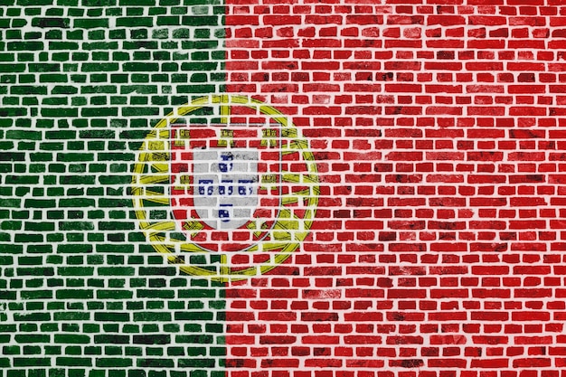 Closeup on a brick wall with the flag of Portugal painted on it