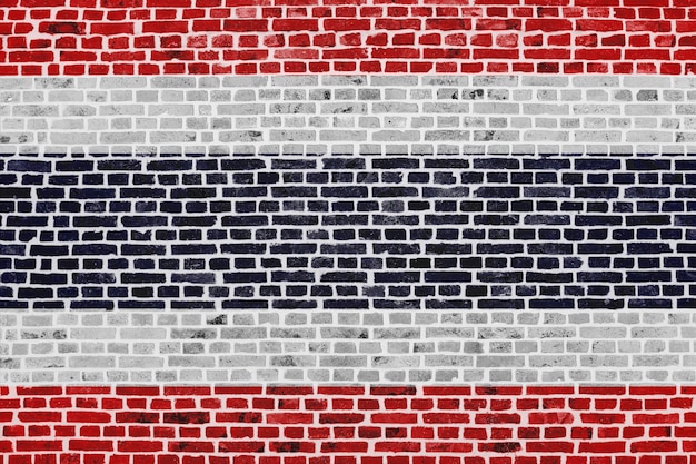 Closeup on a brick wall with the flag of Thailand painted on it