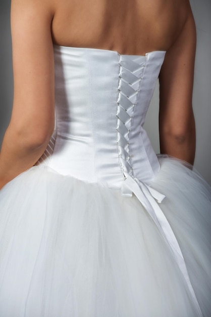 Closeup of bridal gown with corset back