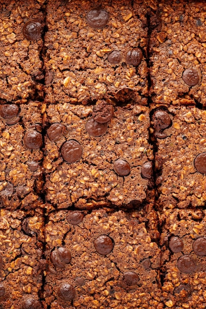 Closeup brownies with chocolate chips and rolled oats macro texture