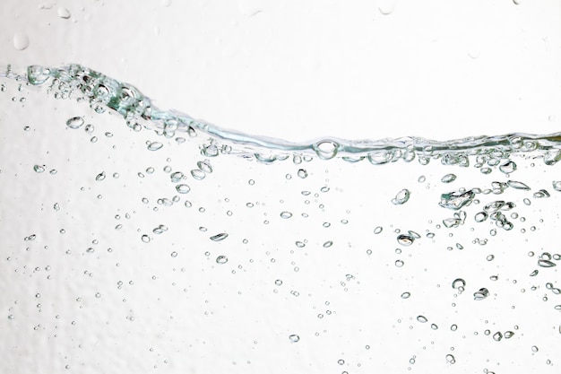 Closeup bubbles underwater on white background.