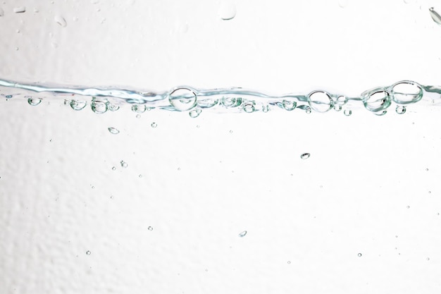 Closeup bubbles underwater on white background.