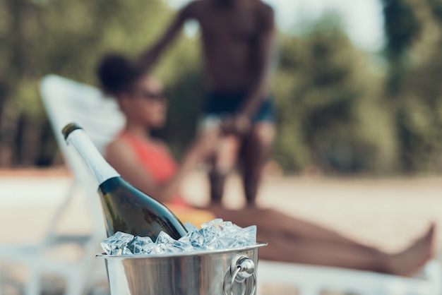 Closeup of Bucket with Ice and Champagne on Foreground