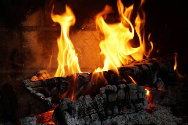 Closeup of burning logs in the fireplace