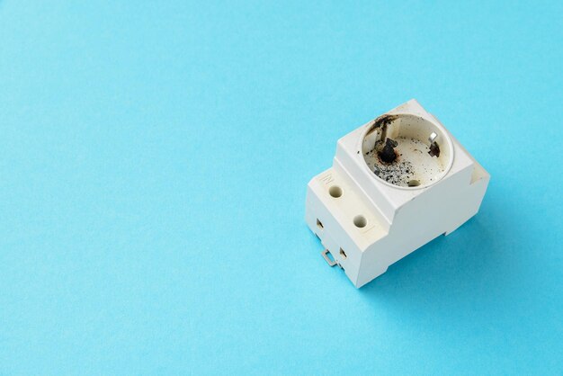 Closeup of a burnt electrical outlet electrical safety concept copy space