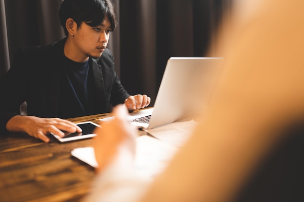 Closeup business hand working to typing computer laptop keyboard in modern office or home workplace desk table businessman using notebook for online technology communication job by using cyberspace