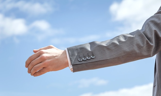 Photo closeup of business man showing his open hand