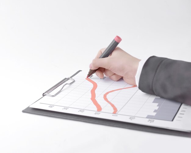 Closeup Businessman drawing a stock chartisolated on white