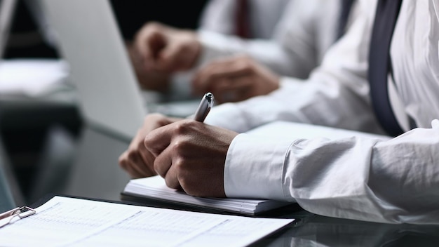 Closeup of businessman filling customer survey form