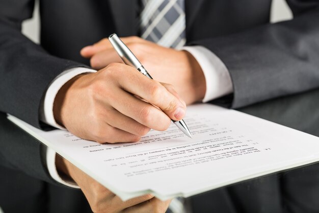 Closeup of a Businessman Signing a Contract