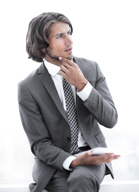 Closeup businessman with digital tablet looking at copy space