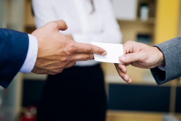 Closeup of businesspeople exchanging business card