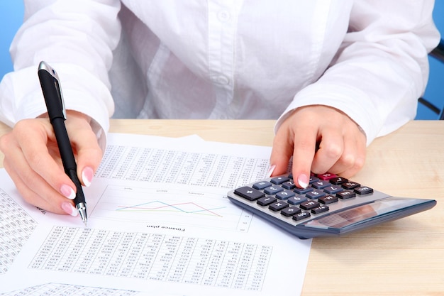 Closeup of businesswoman hands working in office room