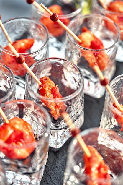 Closeup canape with shrimp in glass soft background