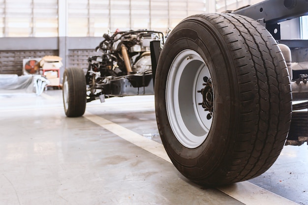 Closeup car chassis with engine. soft-focus and over light in the background