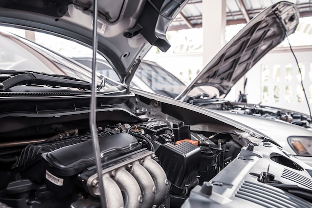 Closeup of a car engine parked in auto car garage for fixed