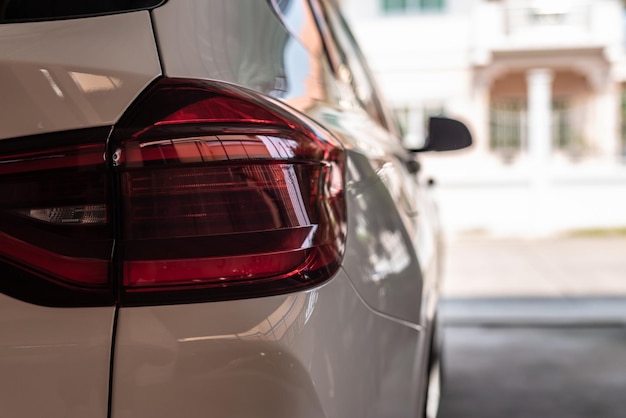 Closeup of car tail light on a white car