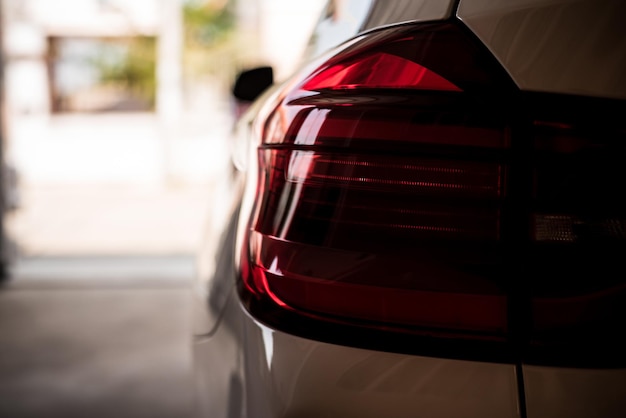 Closeup of car tail light on a white car