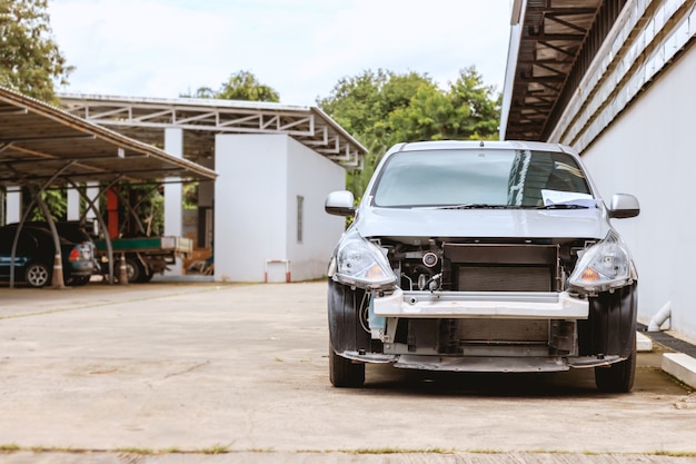 Photo closeup of car waiting for repair with soft-focus and overlight in the background