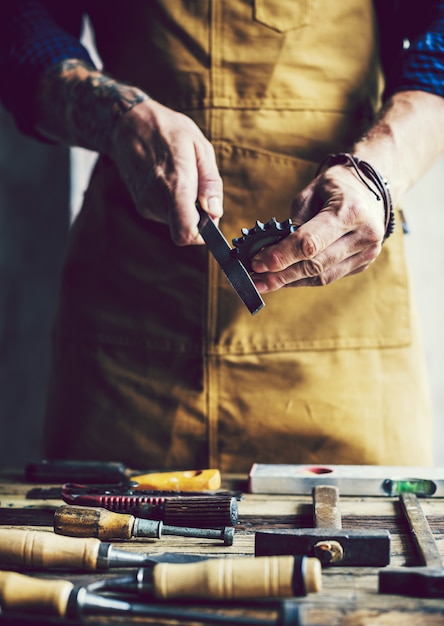 Closeup of carpenter working with his tools