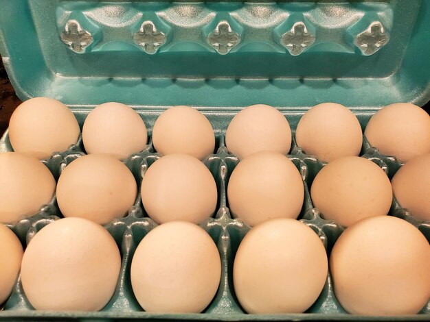 Closeup of a carton of white eggs