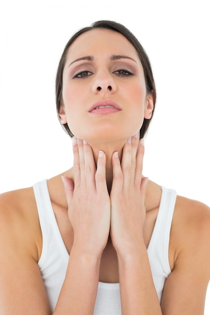 Closeup of a casual woman suffering from neck ache