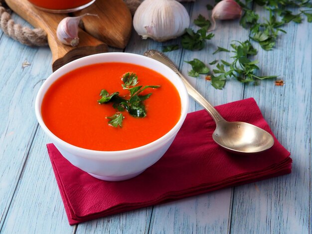 Closeup of ceramic bowl with tomato soup