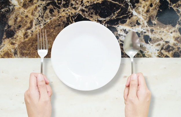 Closeup ceramic dish on marble table textured background