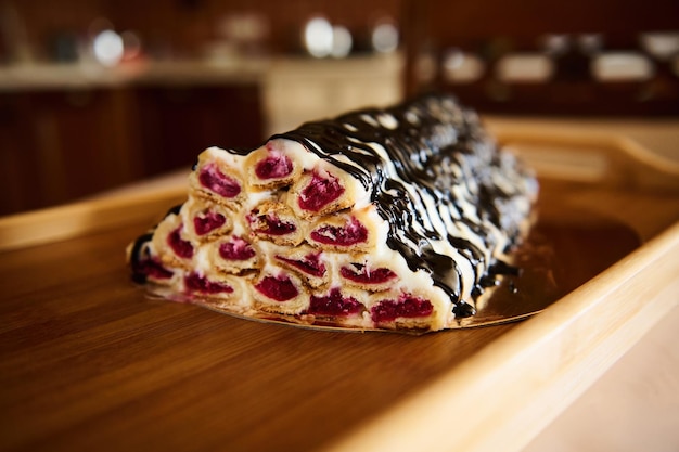 Closeup of a cherry cake monastery hut on a wooden surface Pastry item Pastry item homemade confectionery